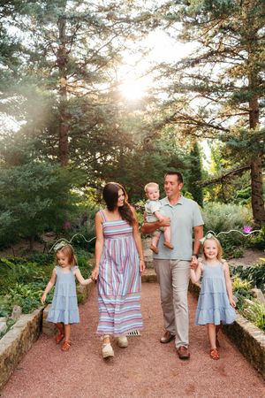 Photo of a family of 5 walking toward the camera