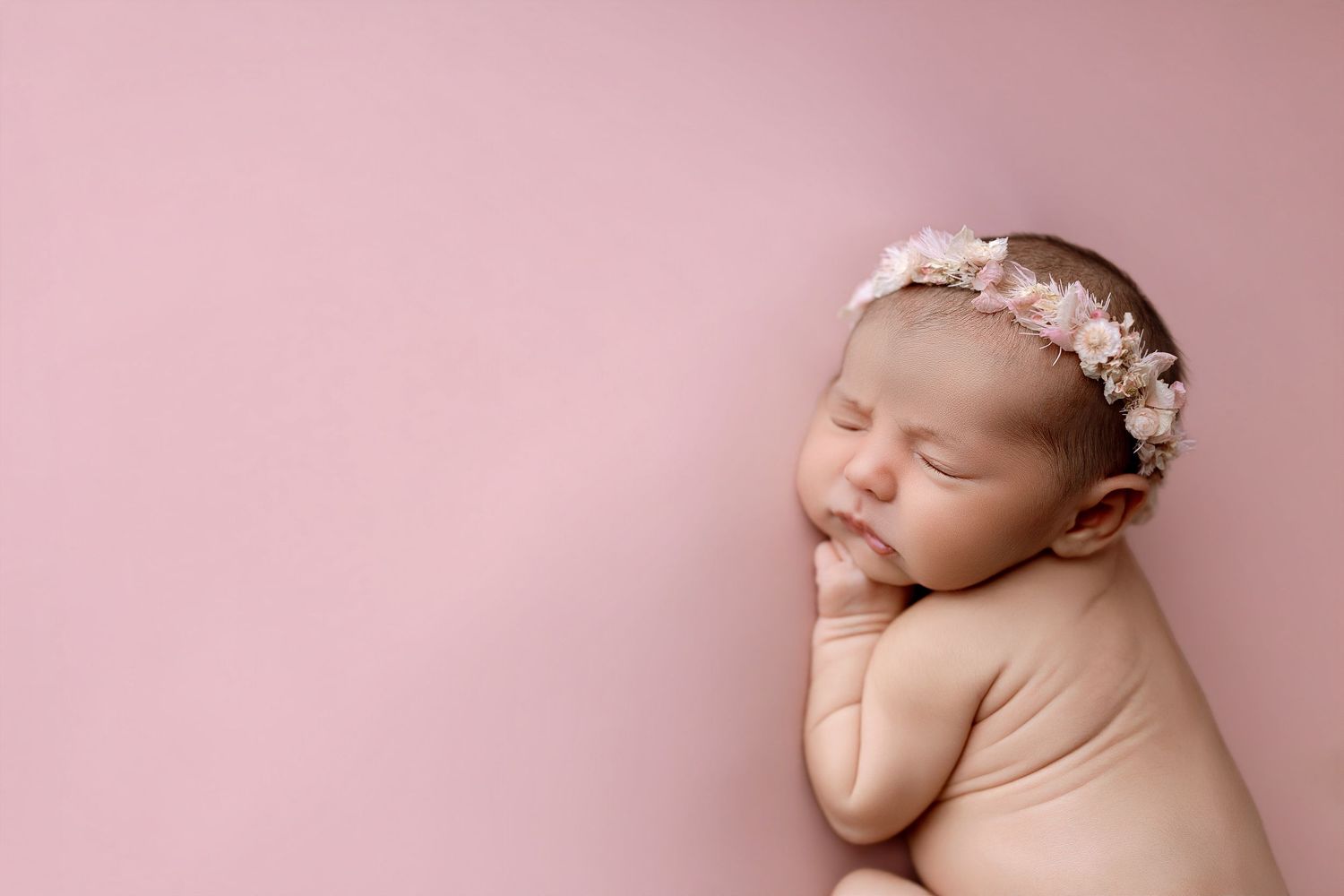 Wrapped mini newborn session in Magnolia TX featuring neutral newborn photography with baby posed in baskets and natural-toned props by Anna