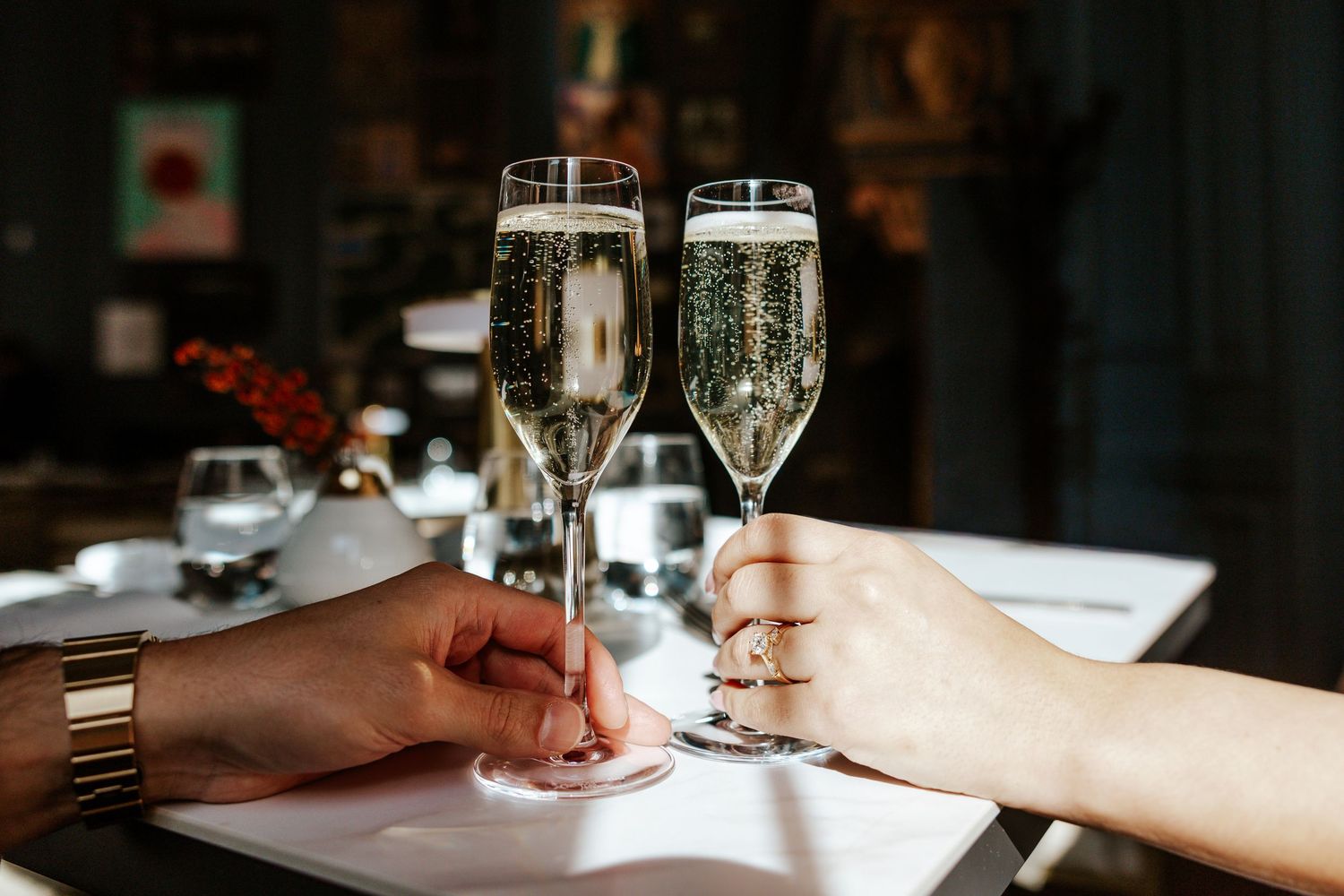 couple holding glasses of champagne during san francisco elopement day