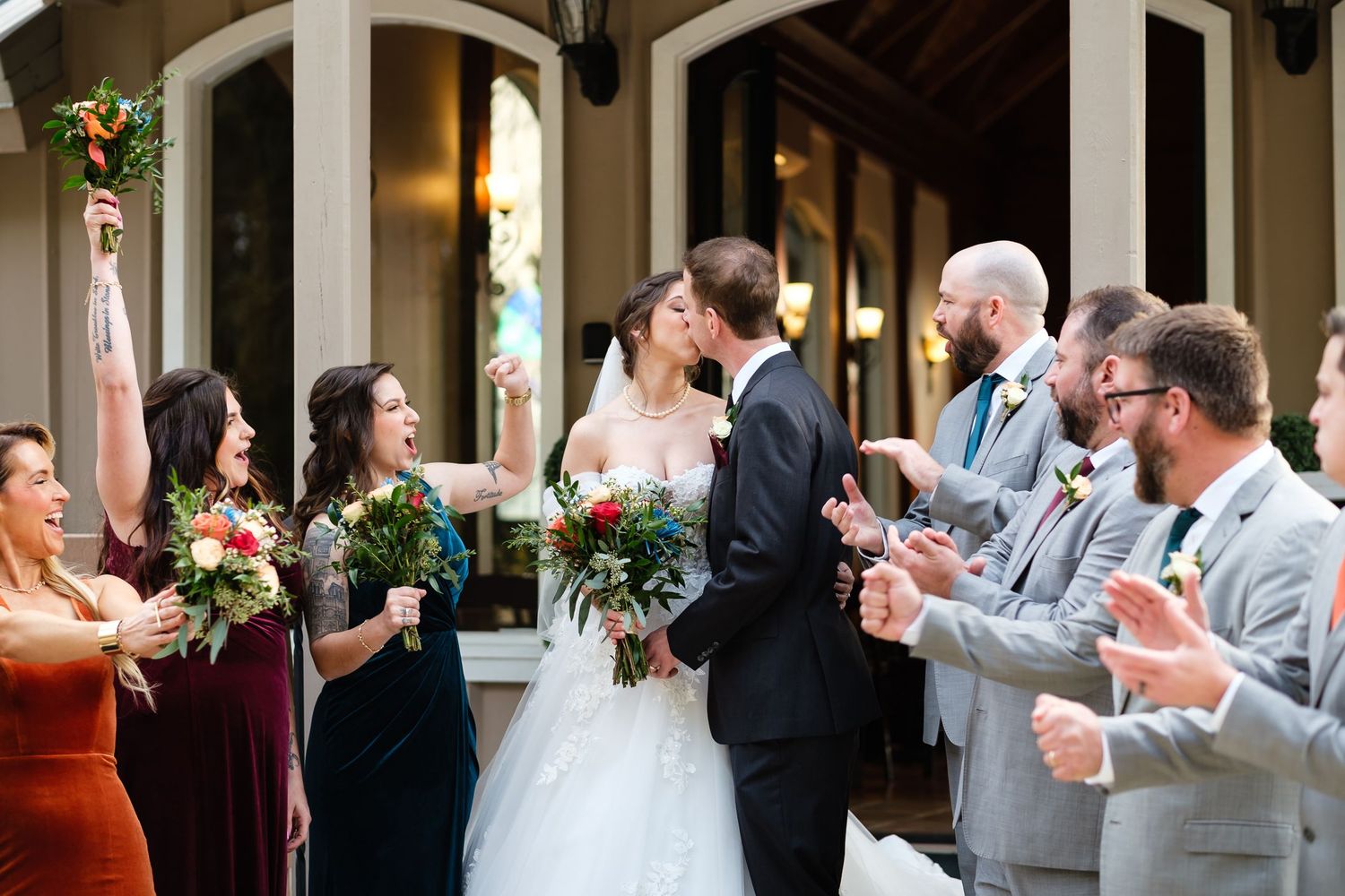 A bride and groom celebrate after a wedding at Chapel Valley Farms with their wedding party near Orlando Fl.