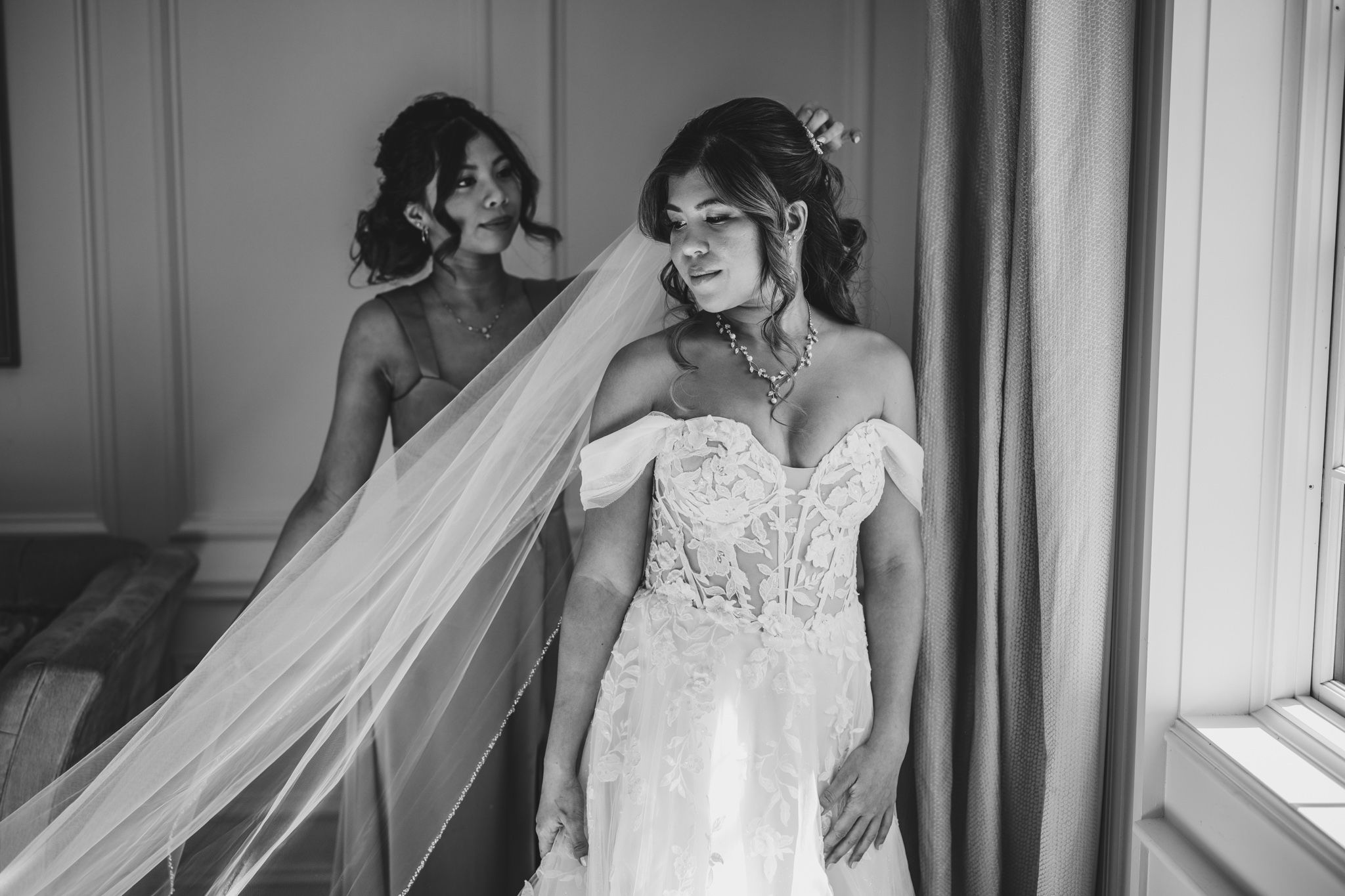 Artistic bridal portraits captured in naturally lit elegant room with classic decor.
