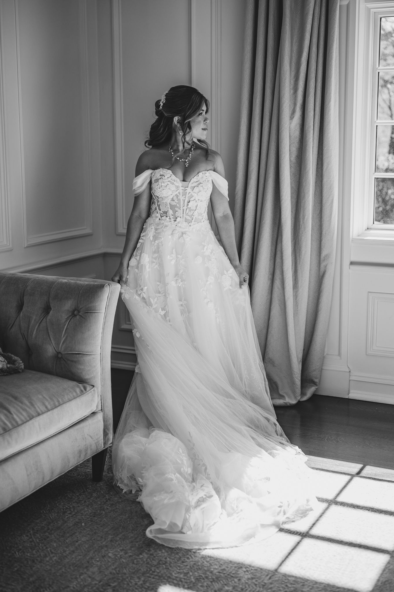 Dramatic black and white photos of wedding dress details in sunlit room.