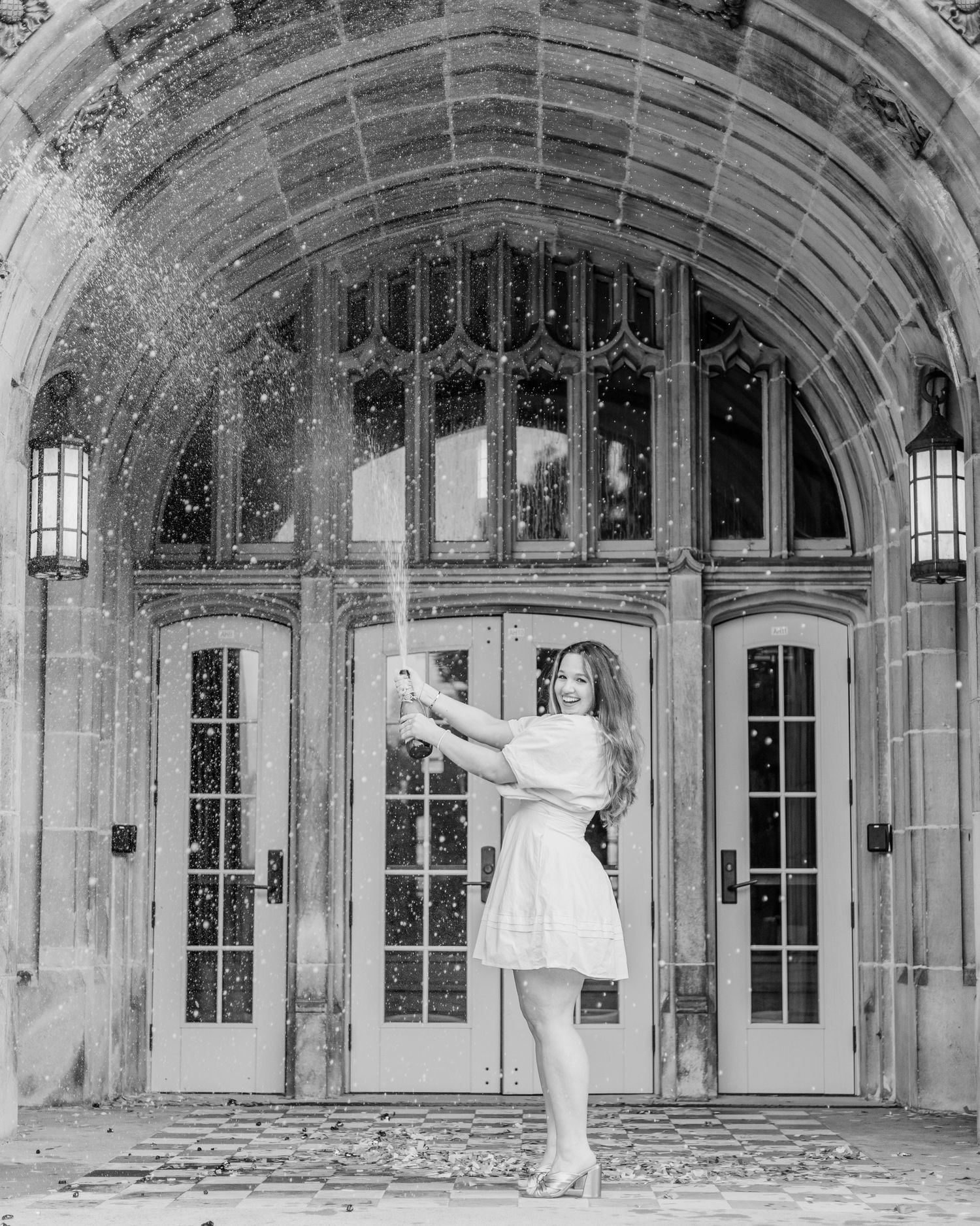 Senior at the University of Tennessee popping champagne celebrating graduating by Sarah Smith Photos Knoxville, Tennessee Photographer.