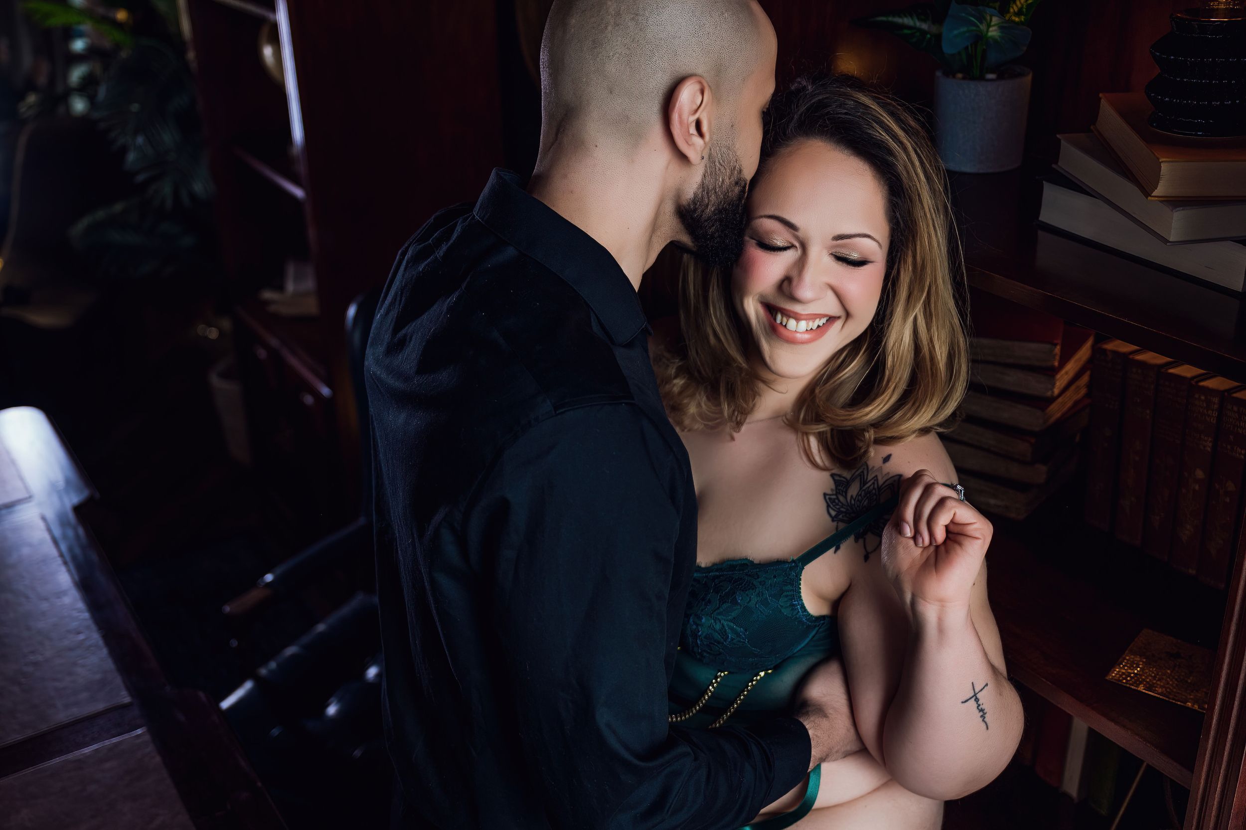 Fun-loving couples boudoir session showcasing laughter and affection - Boudies by Katie May Clicks