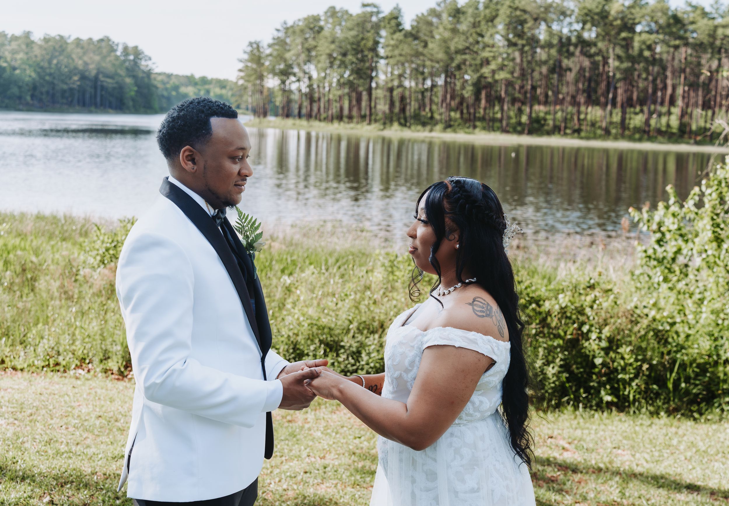 A series of romantic wedding photos taken outdoors by a serene lake with pine trees in the background.