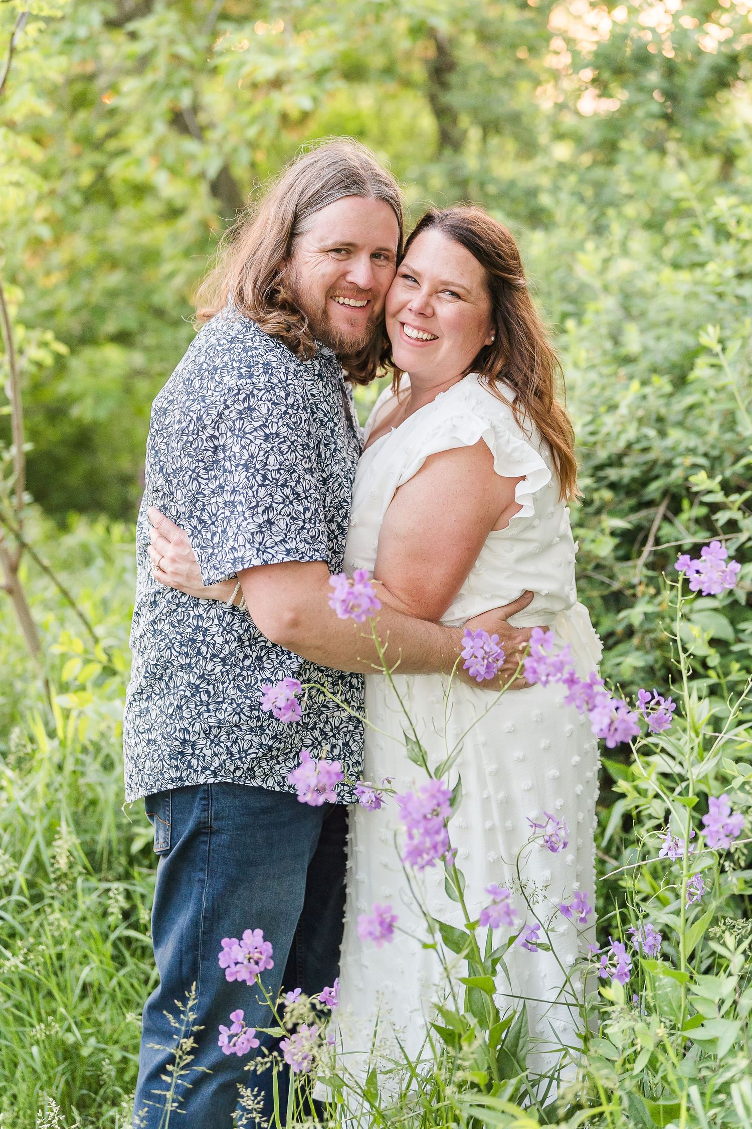 Engaged couple laughing and playfully interacting during their Kenosha engagement session.