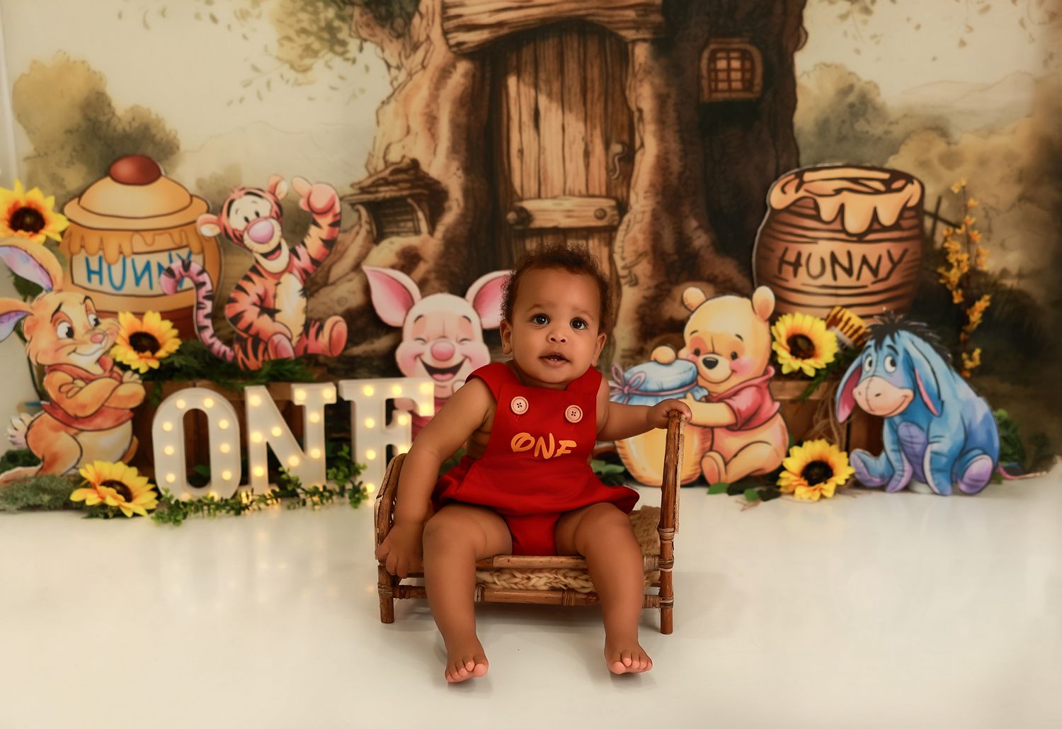 A collage strip of vintage-style photos featuring Winnie the Pooh themed decorations and props in warm sepia tones.