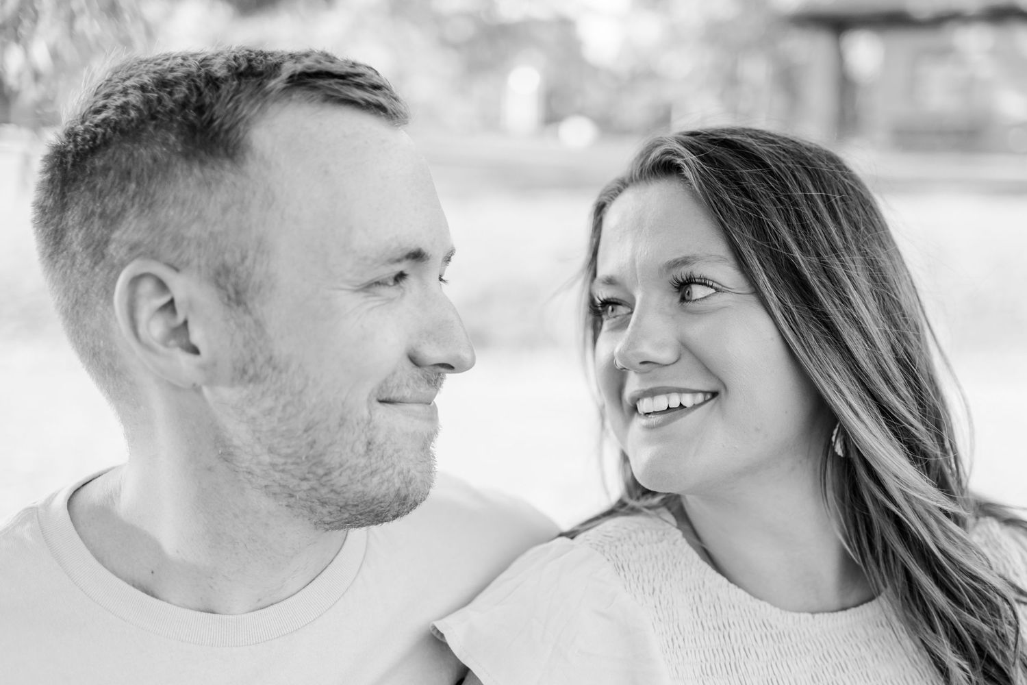 Intimate black and white portrait captures a couple's loving connection.