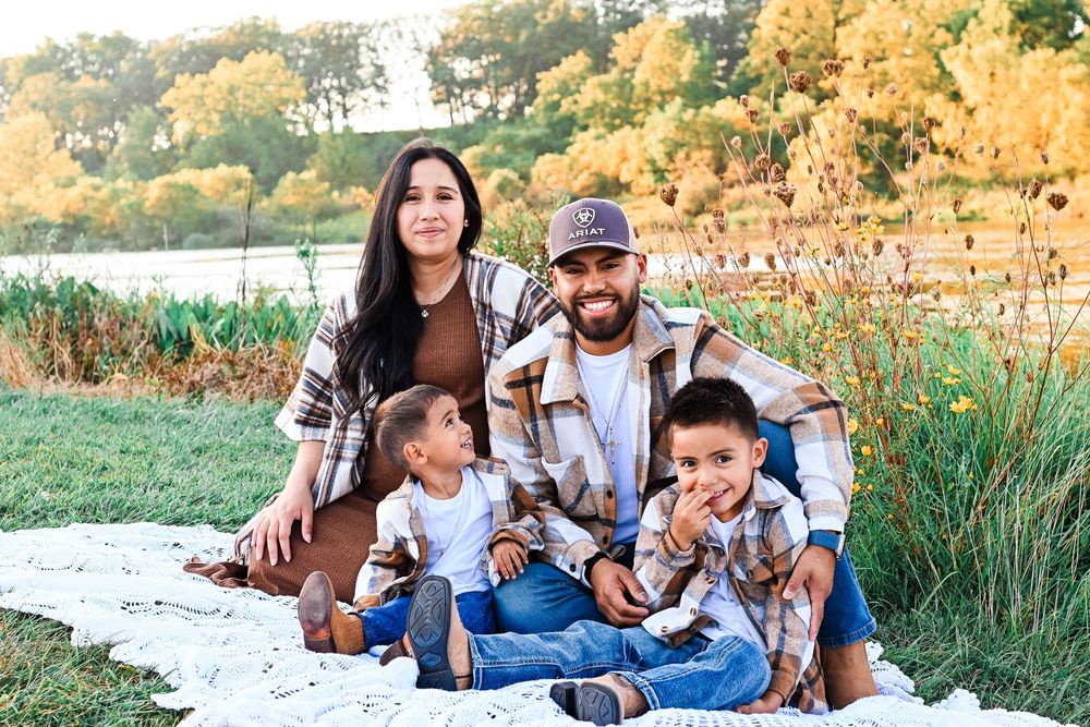 Mother, Father, Children family picture sitting by lake at Prophetstown State Park in Lafayette, IN.