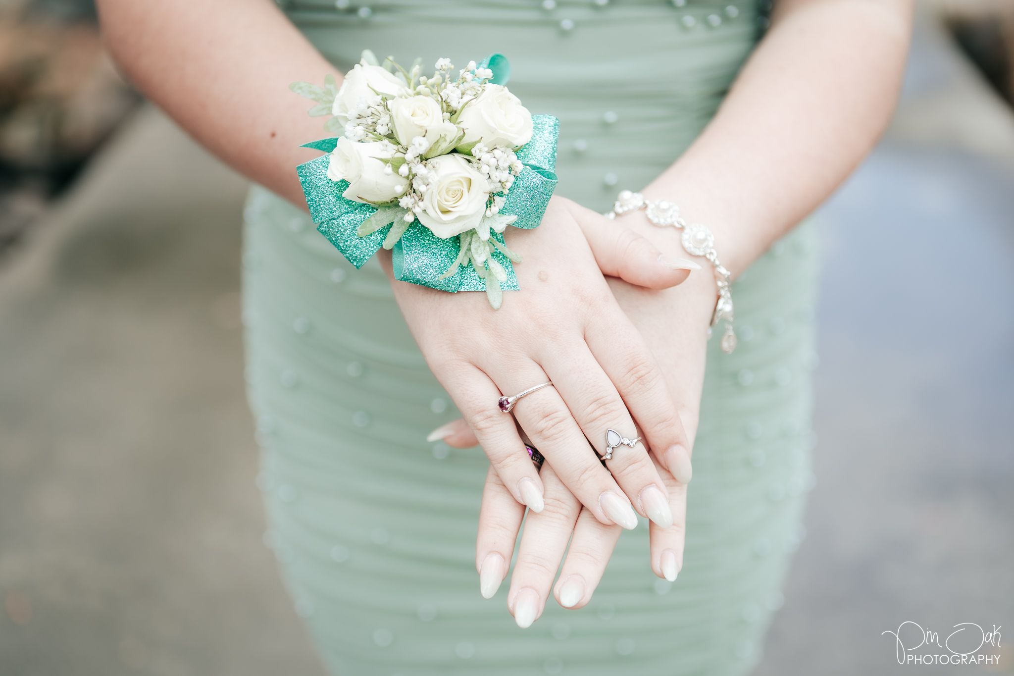 Prom portrait of details - corsage, nails, jewelry