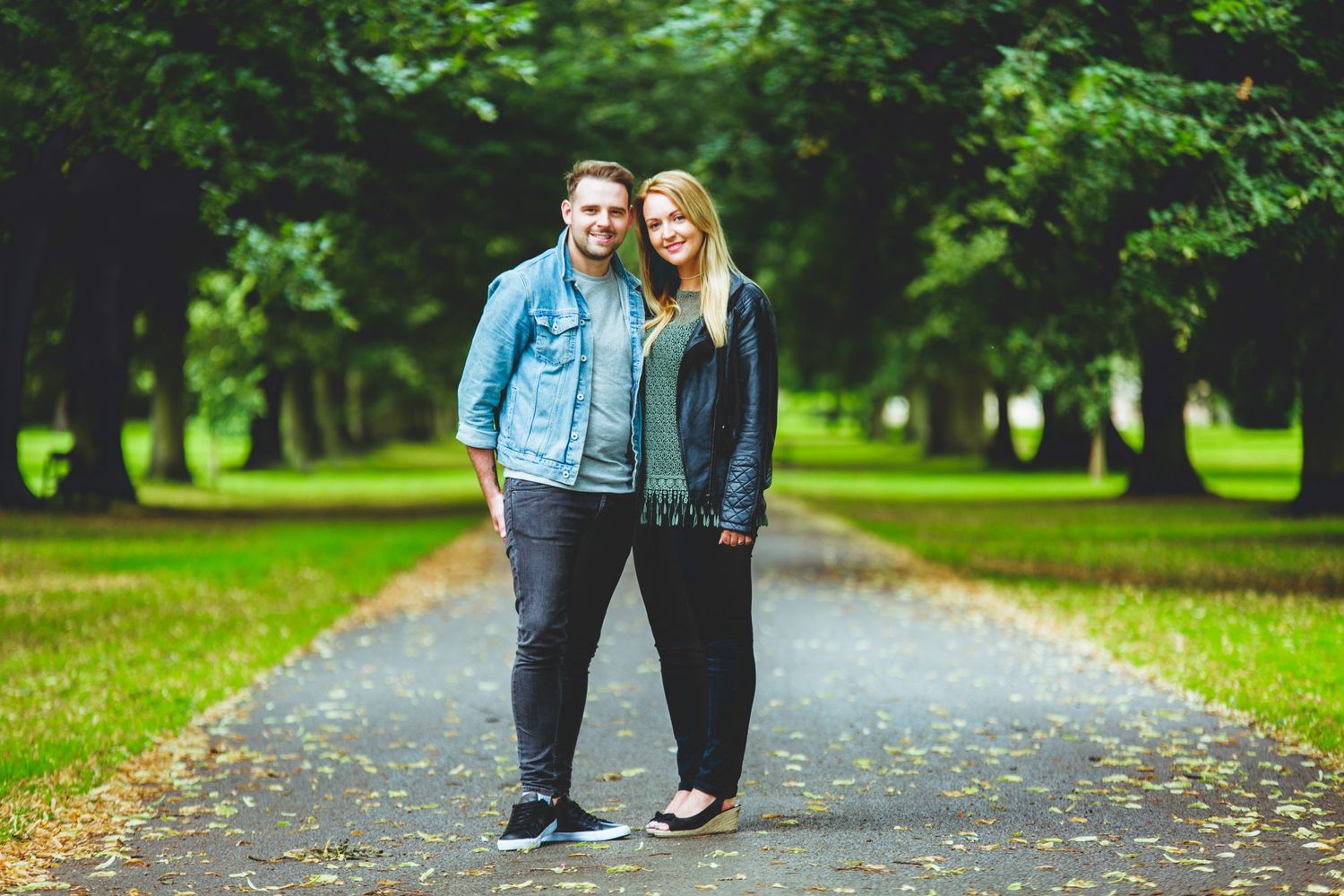 a couple on their engagement session smiling and laughing at Himley Hall where the session was hosted