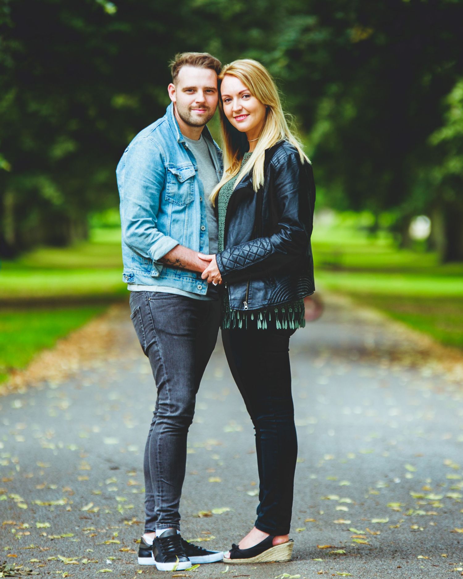 a couple on their engagement session smiling and laughing at Himley Hall where the session was hosted