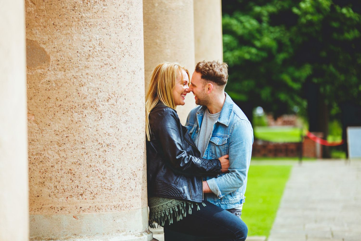 a couple on their engagement session smiling and laughing at Himley Hall where the session was hosted