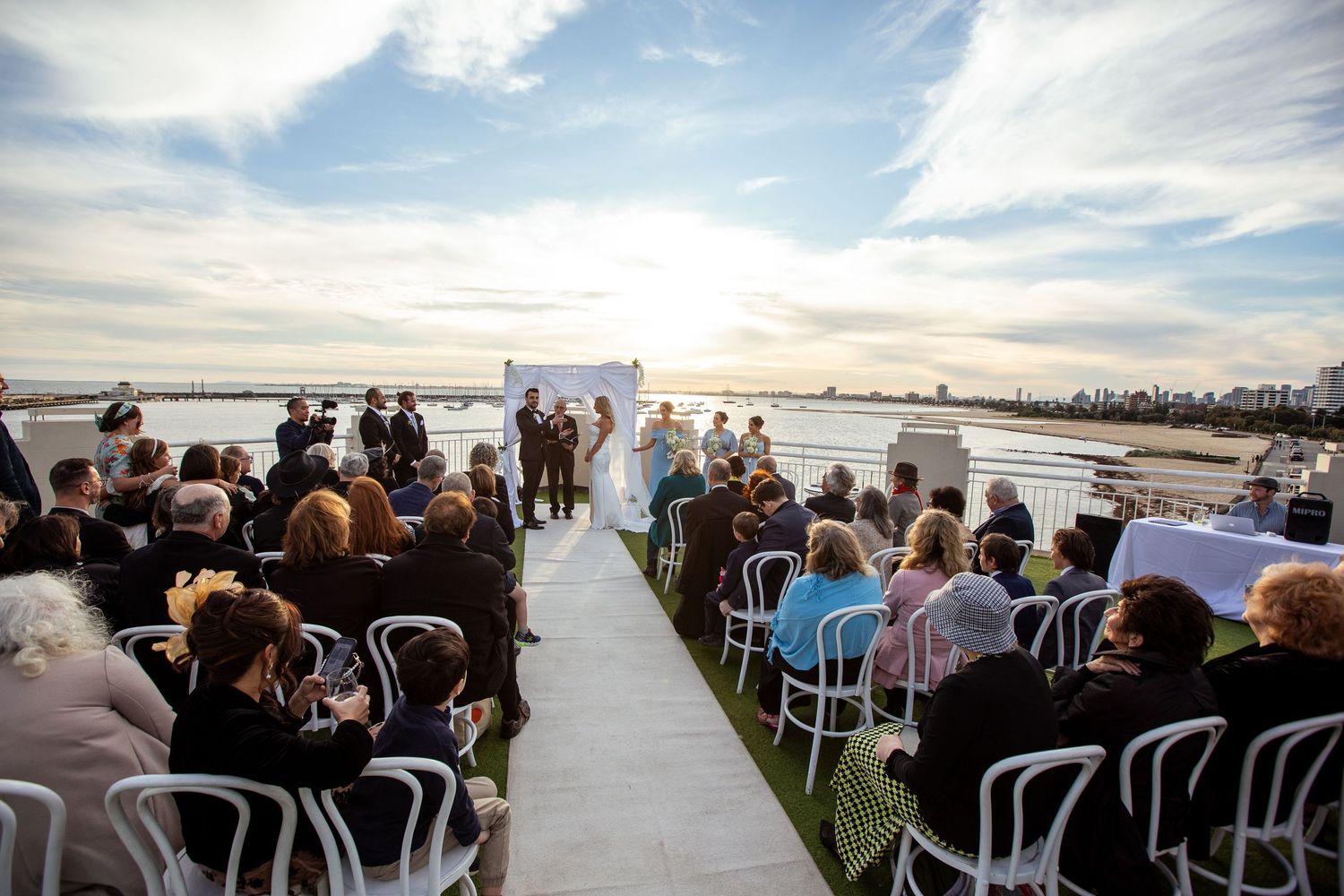 Elegant Bride and Groom saying their vows during their ceremony (Wedding Ceremony captured by Lesley Marks)