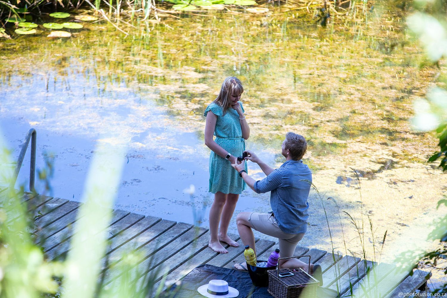 intimate moment, down on one knee and asking her to marry him (couple proposal captured by Lesley Marks)