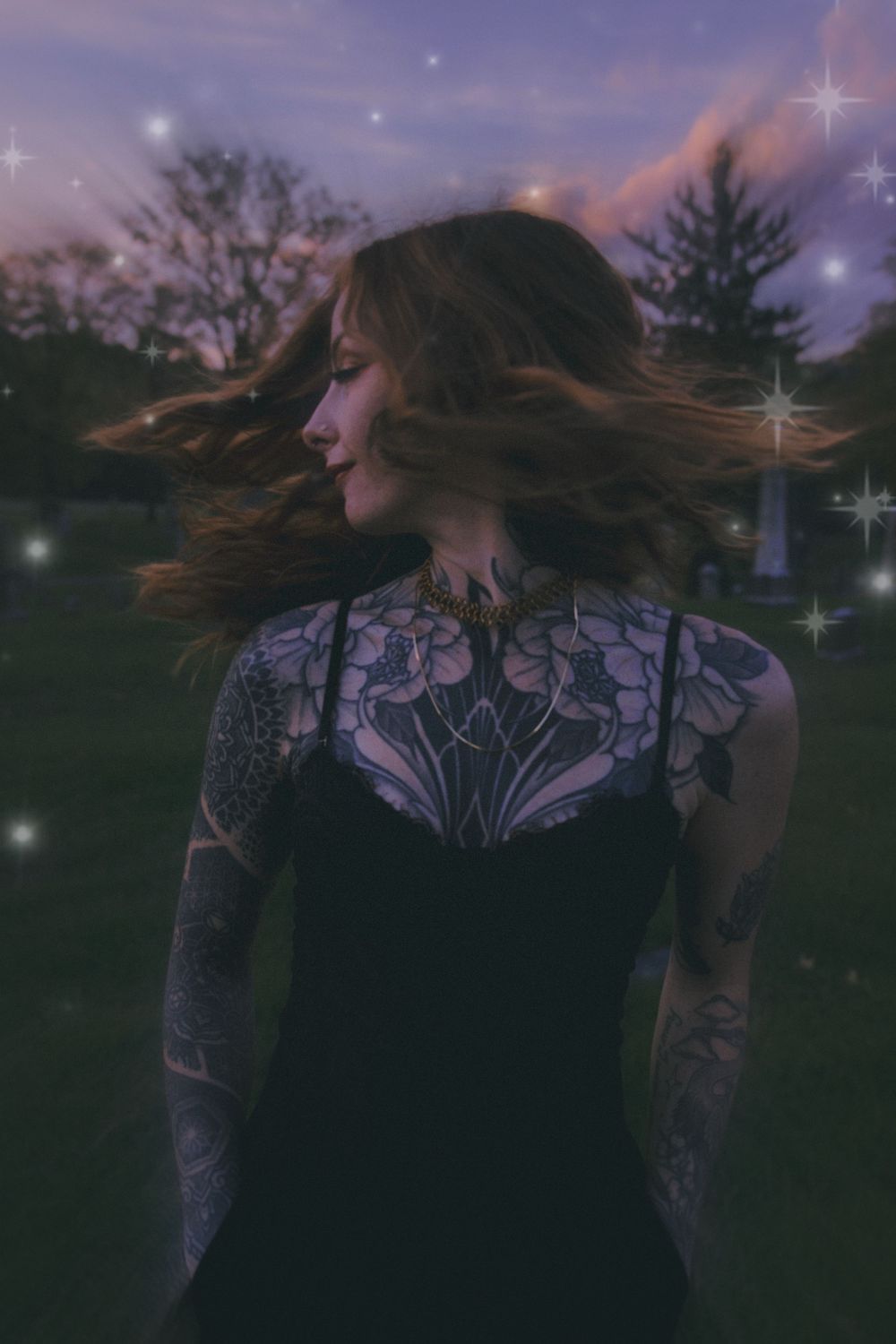 Ethereal twilight portrait with twinkling star effects and flowing dark hair.