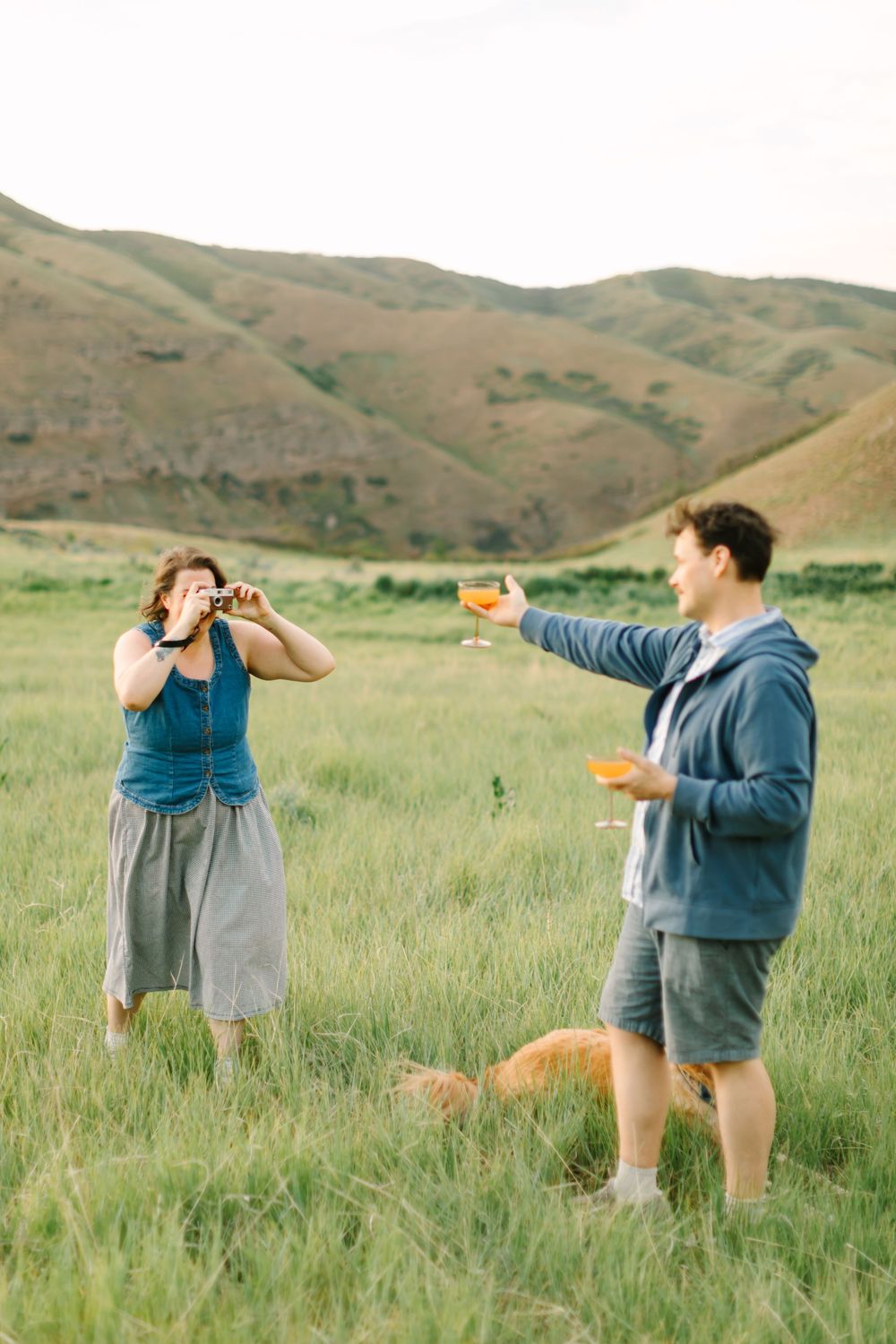 Becky Green Photography about me,  couple having a drink in the mountains with dog and polaroid