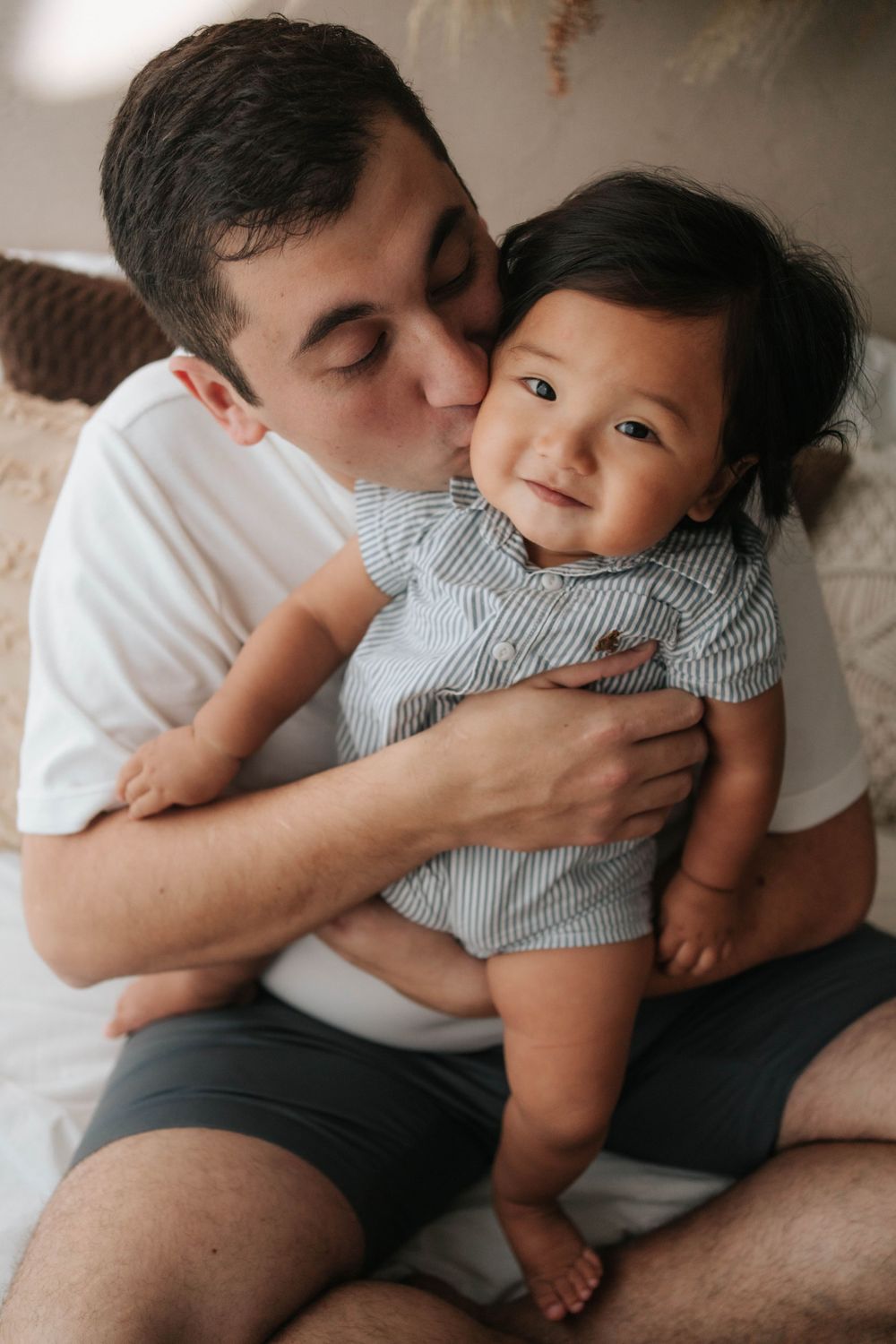 Intimate parent-child bonding moments on dark background.