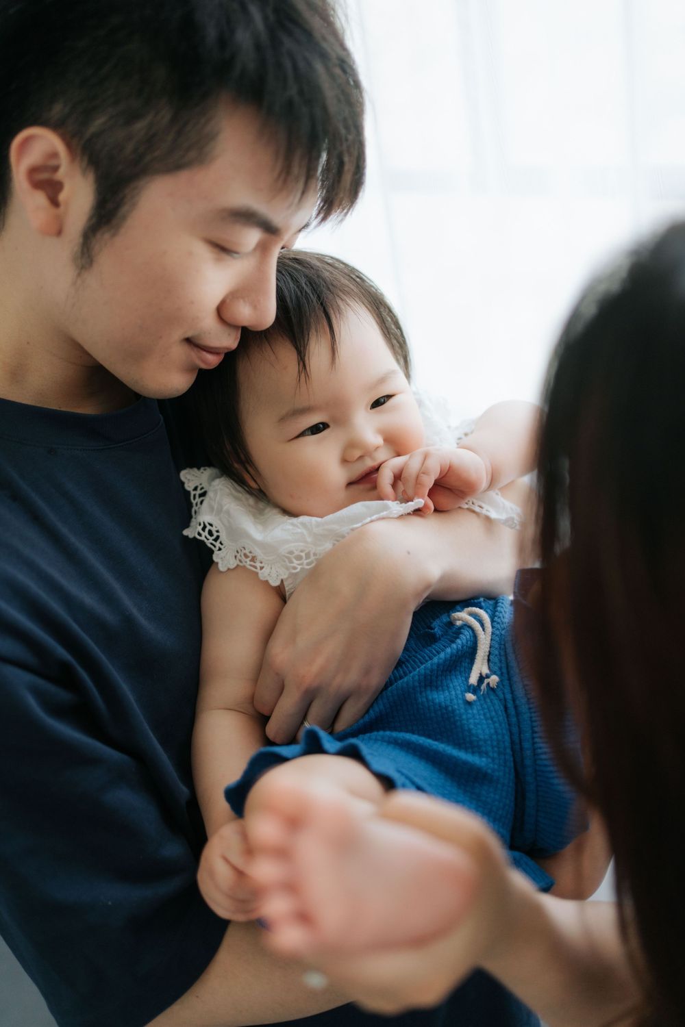 Intimate family bonding moments captured in natural lighting.