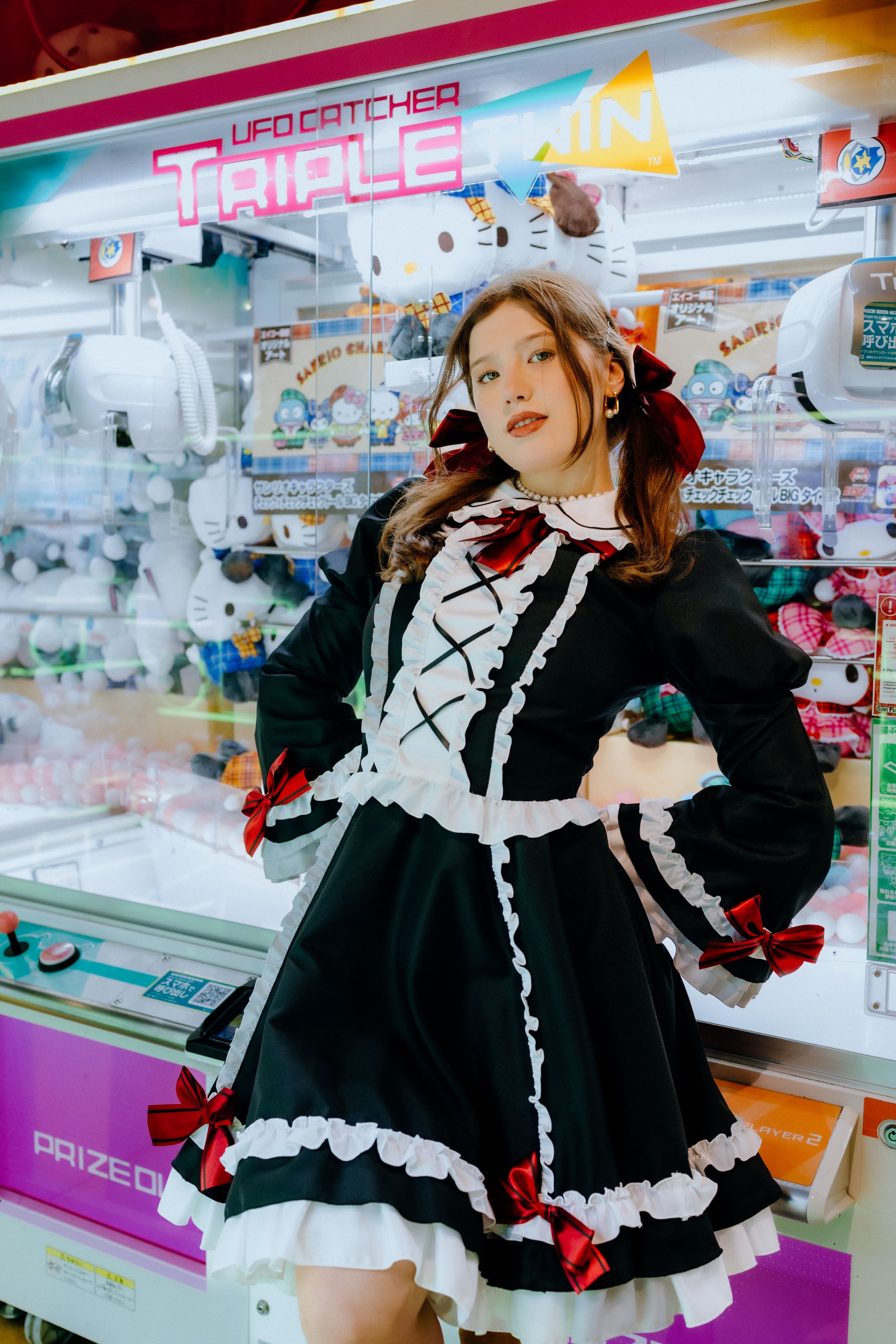 Gothic Lolita fashion photoshoot at Japanese arcade with UFO catcher machines.