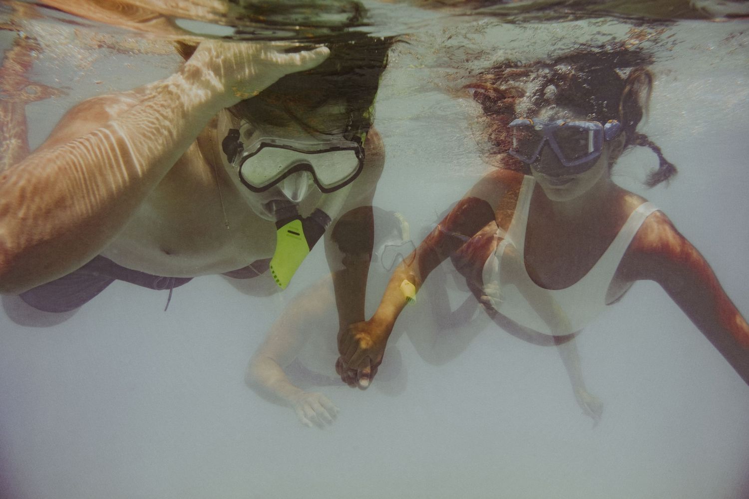 cute couple underwater, elopement activities, dues exposure, Hawaii underwater couples pictures
