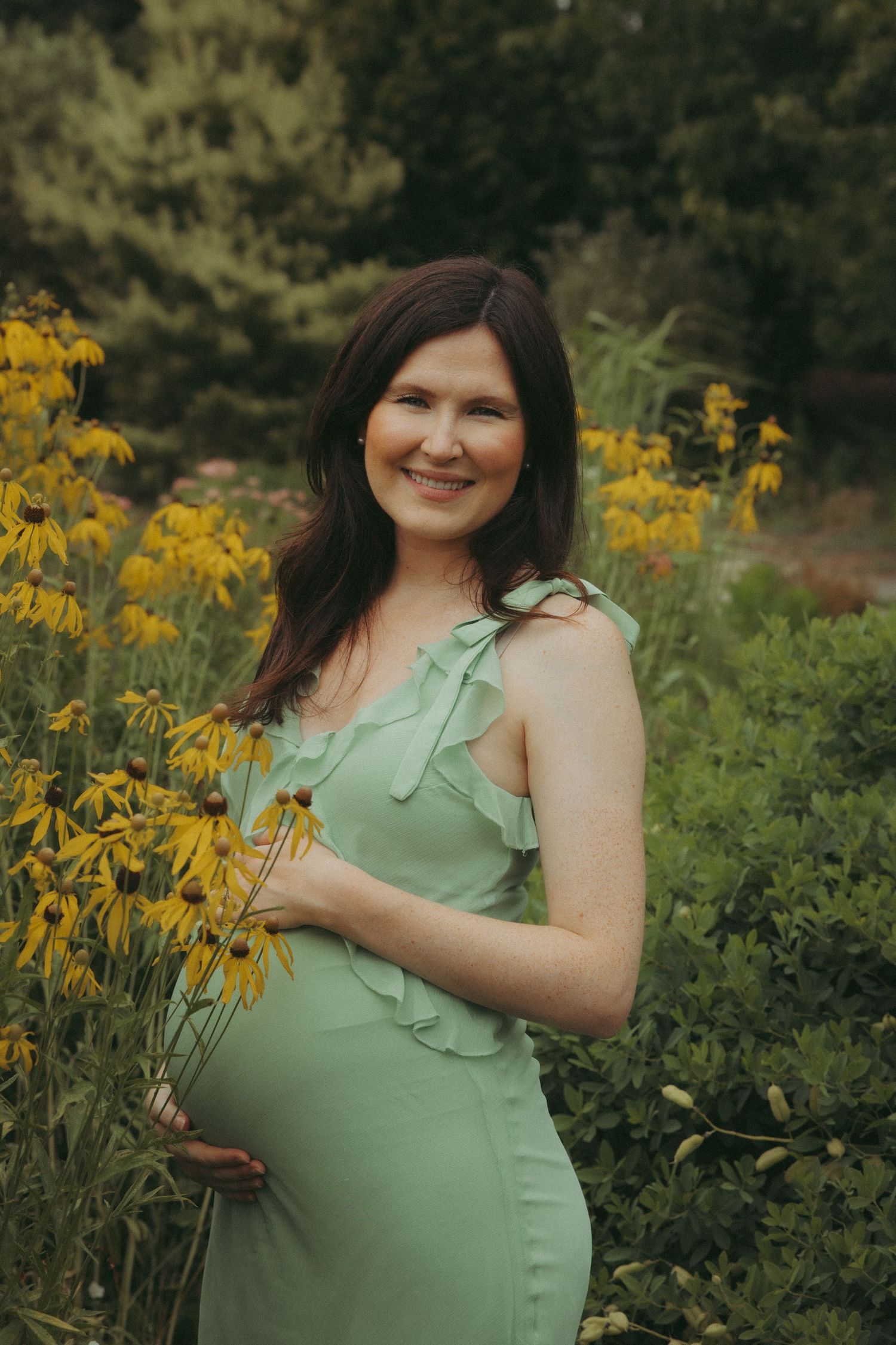 Maternity photo outdoors at sunset.