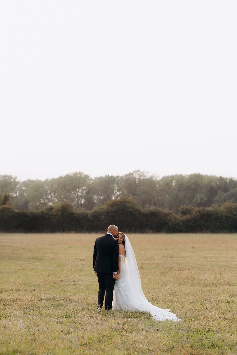 Cotswolds wedding photographer capturing natural moments at countryside wedding venue.