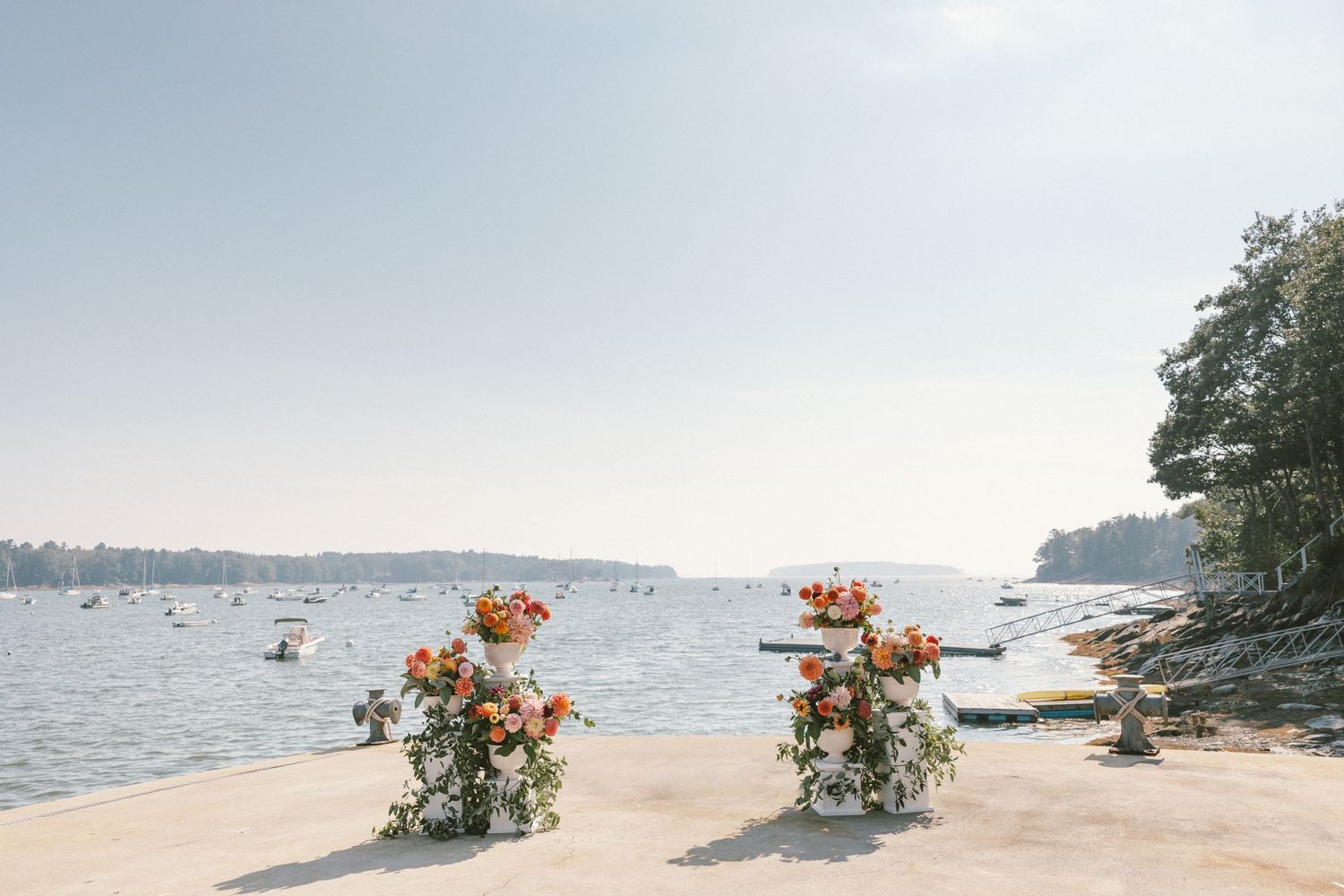 Seaside wedding venue with floral arrangements and ocean views.