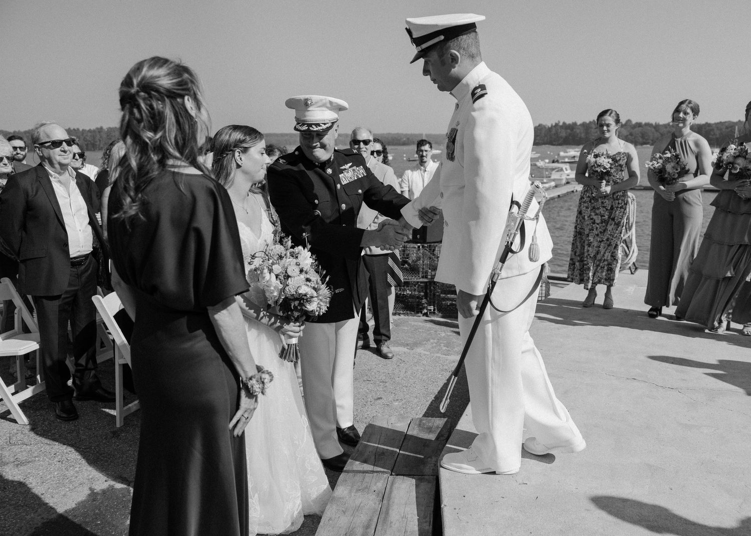 Black and white photo of a military wedding ceremony outdoors.