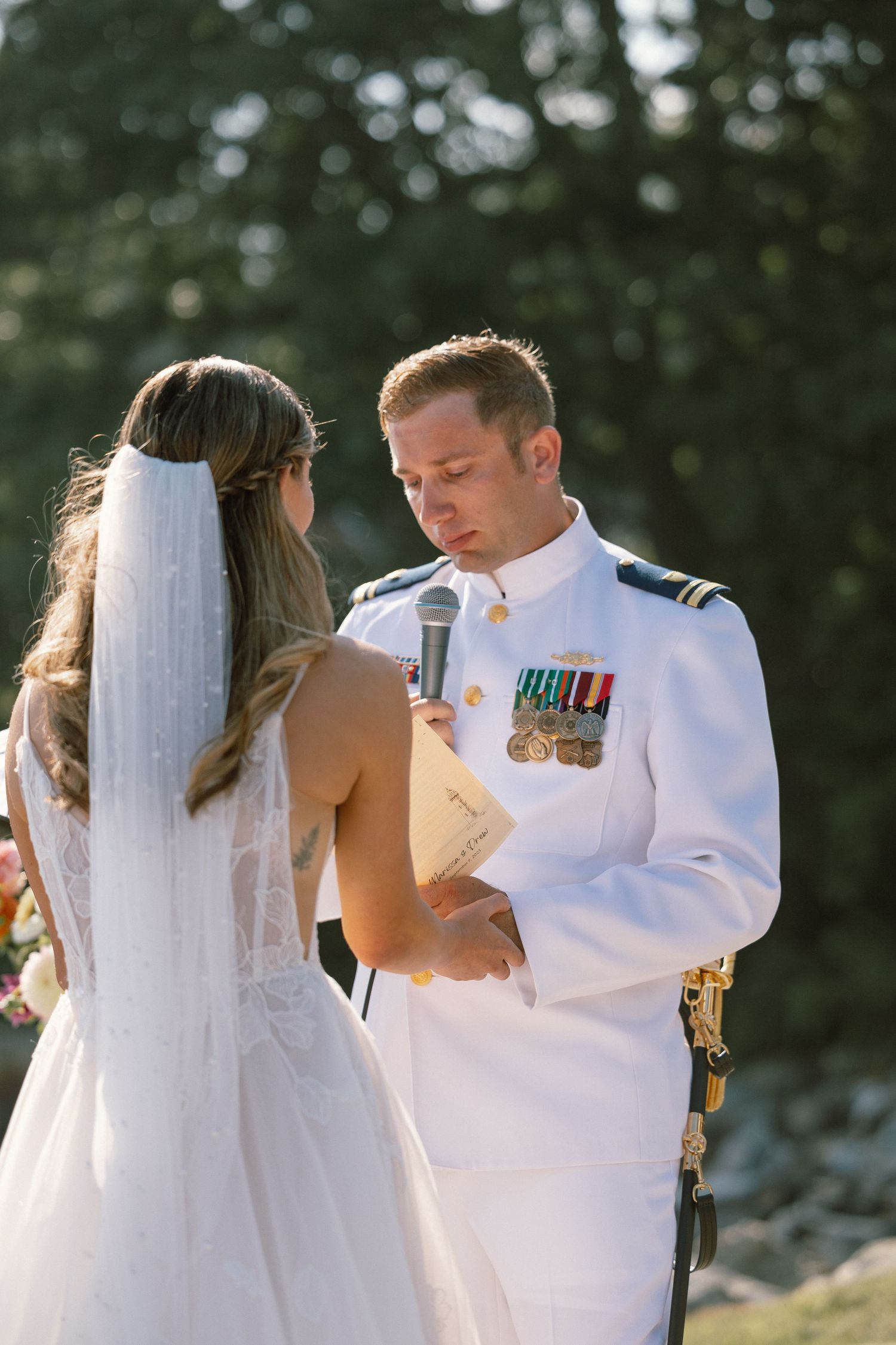 Military wedding couple sharing an intimate moment during sunset.