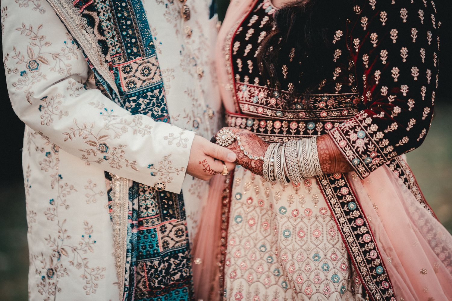 Close-up detail of intricate embroidery on traditional Indian wedding attire. Indian Wedding Photography Toronto GTA