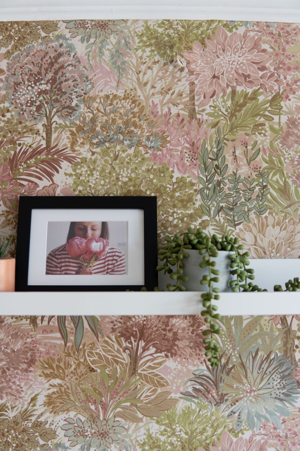 Family photos framed in a stylish room photographed by BLOOM Fabulous Photography