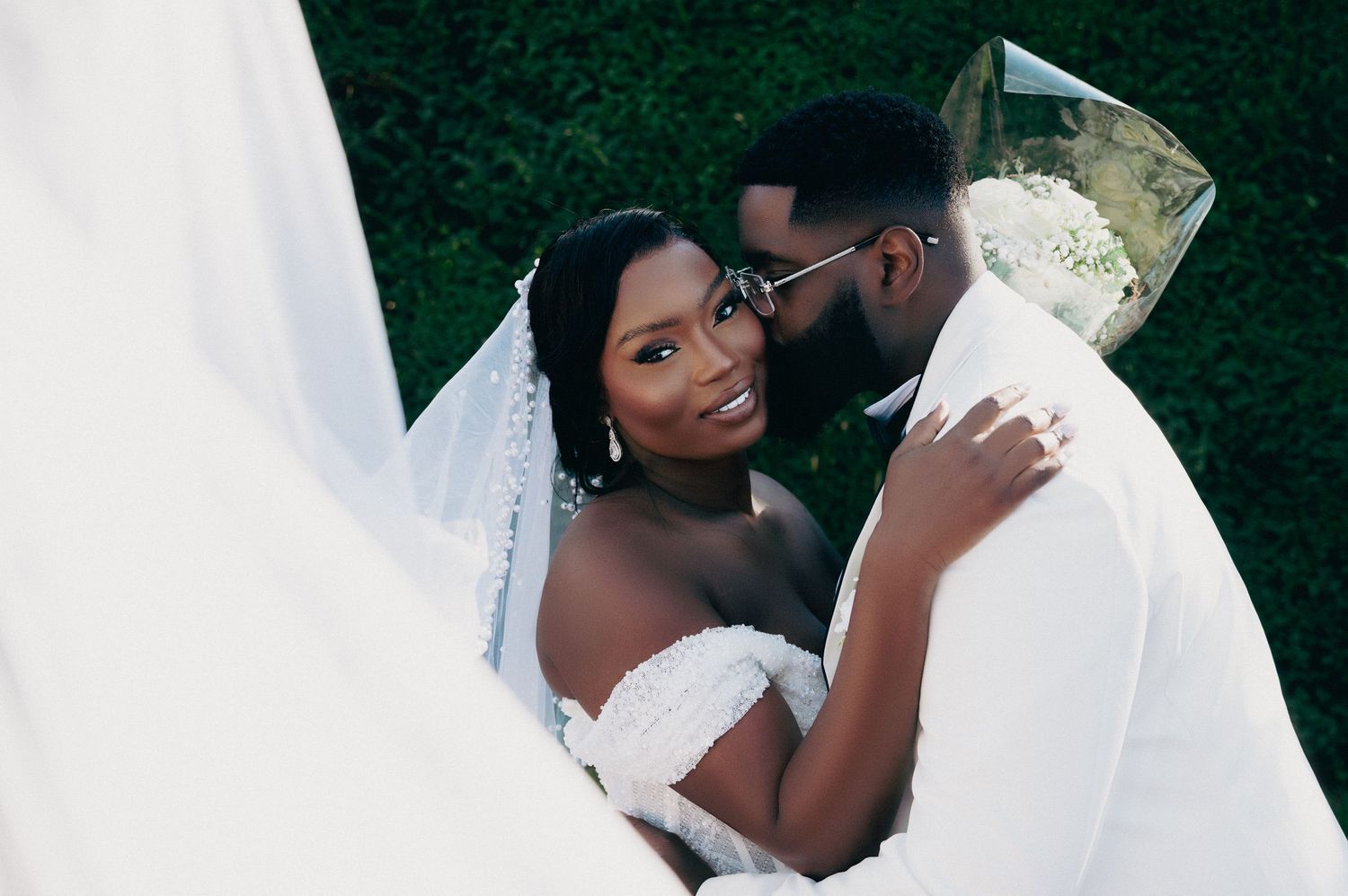 A wedding celebration in an ornate church interior with guests capturing the moment.