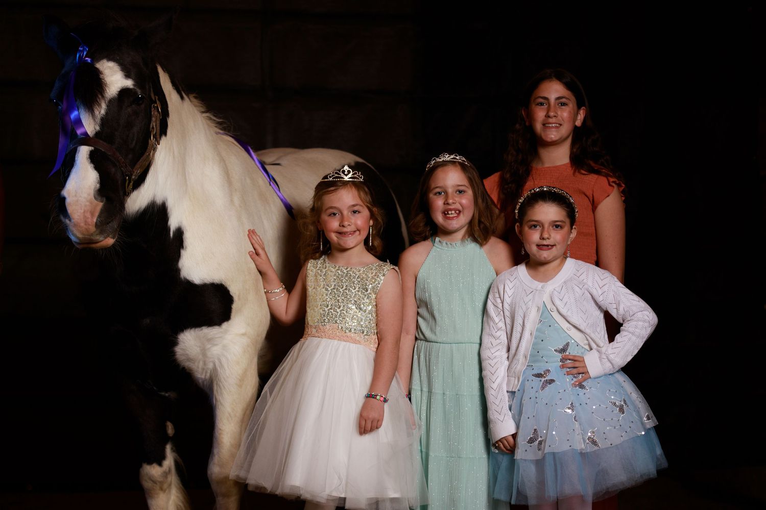 Princess dressed girls with paint pony