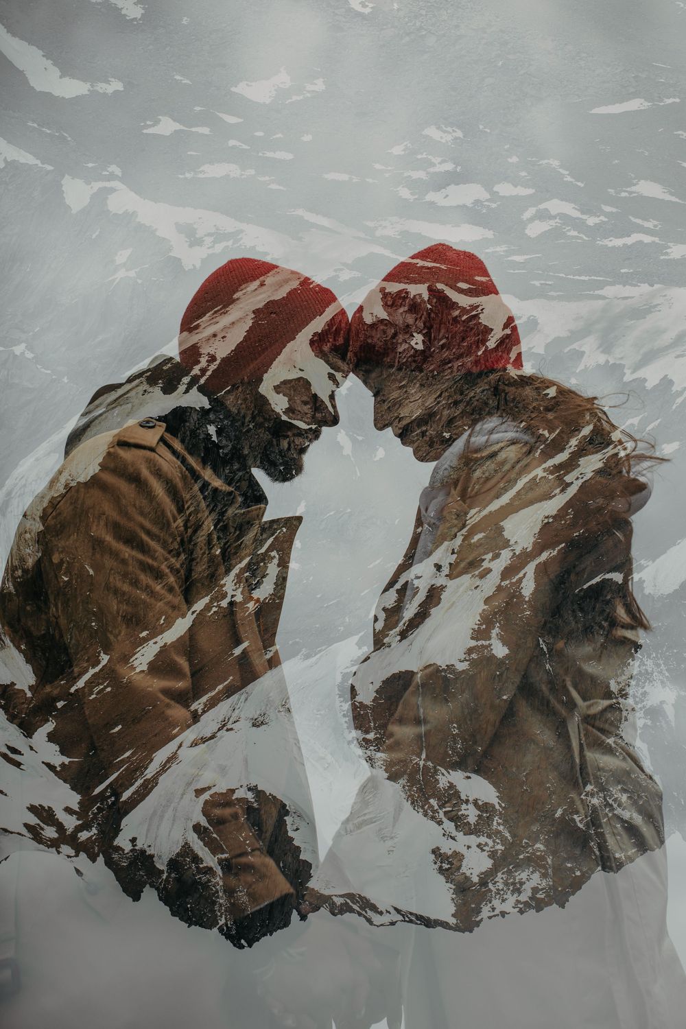 Couple standing forehead to forehead and holding hands