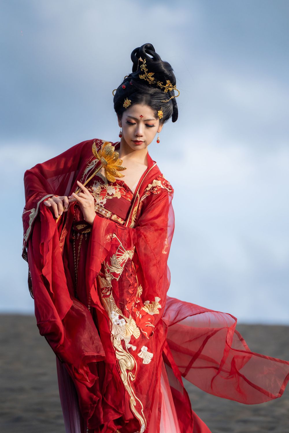 Cinematic solo portrait in flowing red Hanfu at Lake Wainamu sand dunes, evoking a fateful Desert Princess vibe, by Imagine Image Studio.