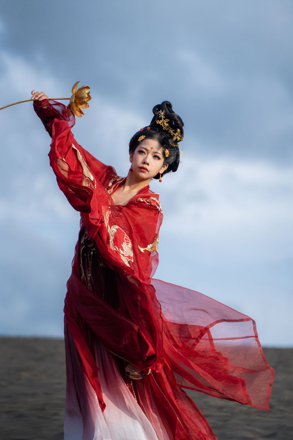 Cinematic solo portrait in flowing red Hanfu at Lake Wainamu sand dunes, evoking a fateful Desert Princess vibe, by Imagine Image Studio.