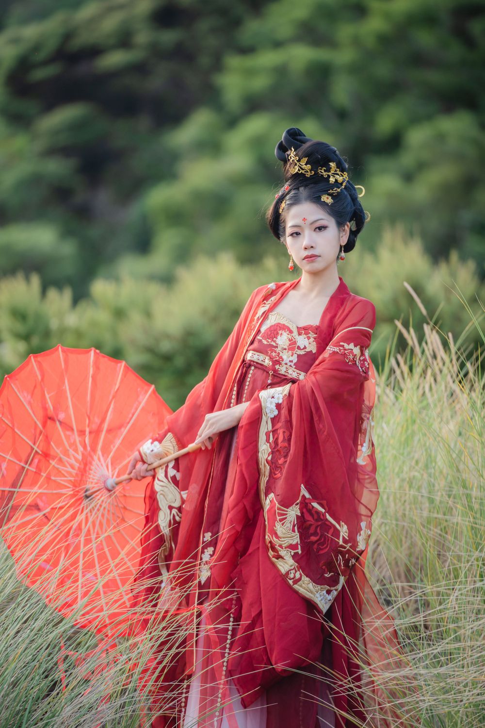 Cinematic solo portrait in flowing red Hanfu at Lake Wainamu sand dunes, evoking a fateful Desert Princess vibe, by Imagine Image Studio.