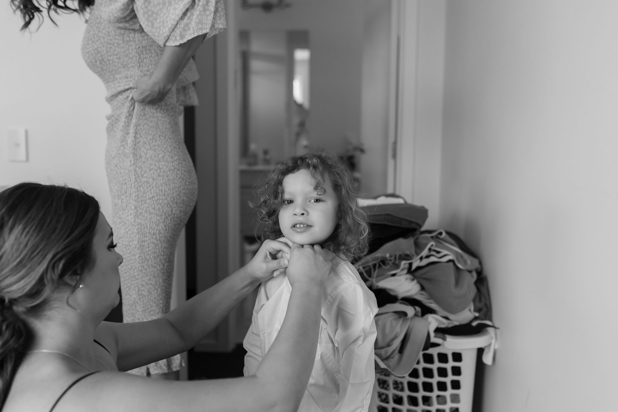 Black and white image of getting ready for a special occasion with a child.
