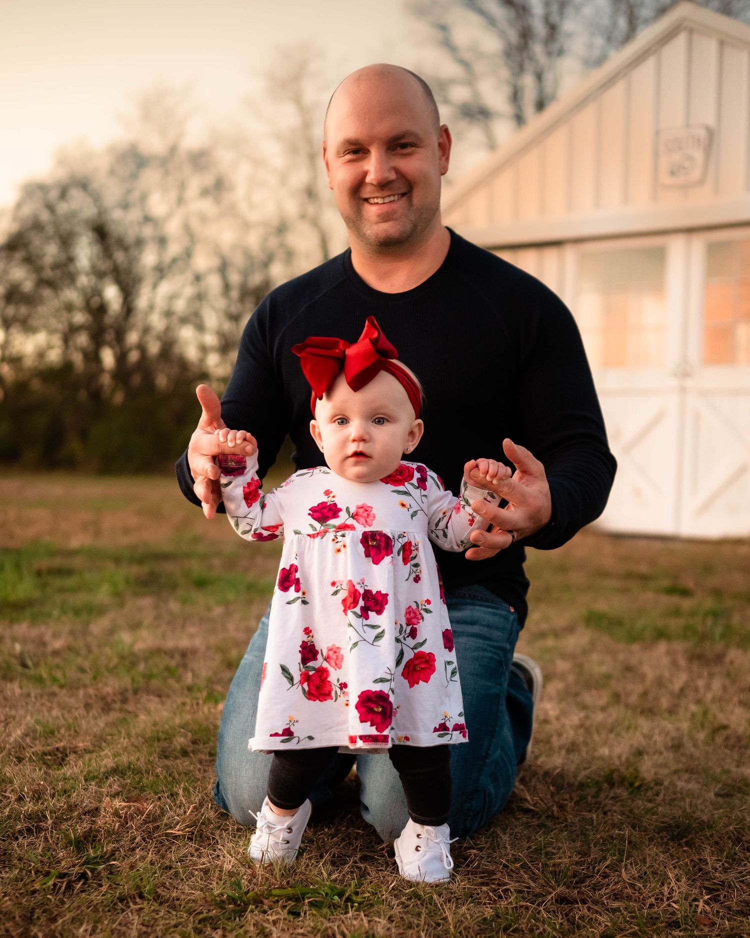 Sweet outdoor photo series featuring a baby in a floral outfit.