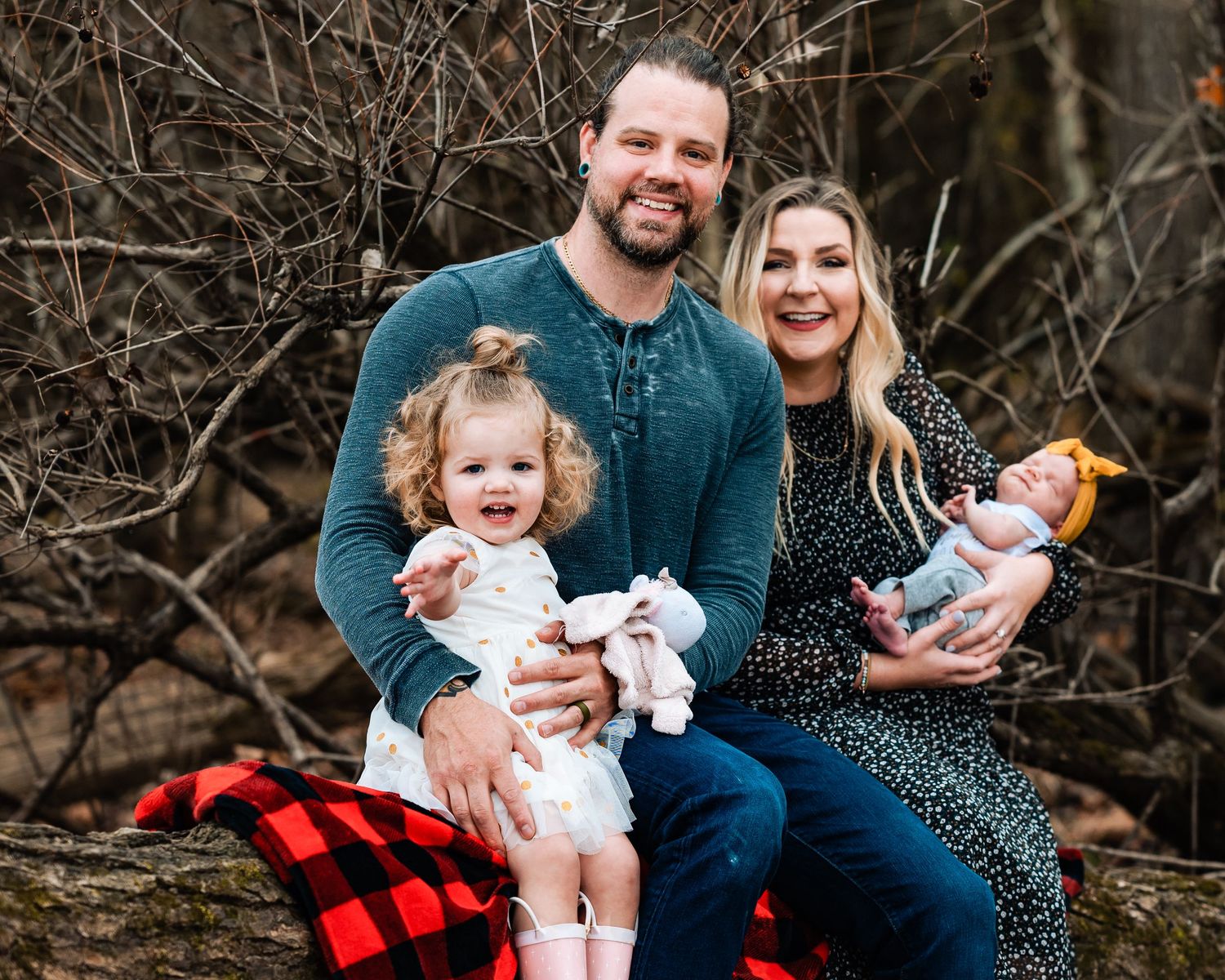 Candid family moments captured in a series of outdoor portraits against natural backdrop.
