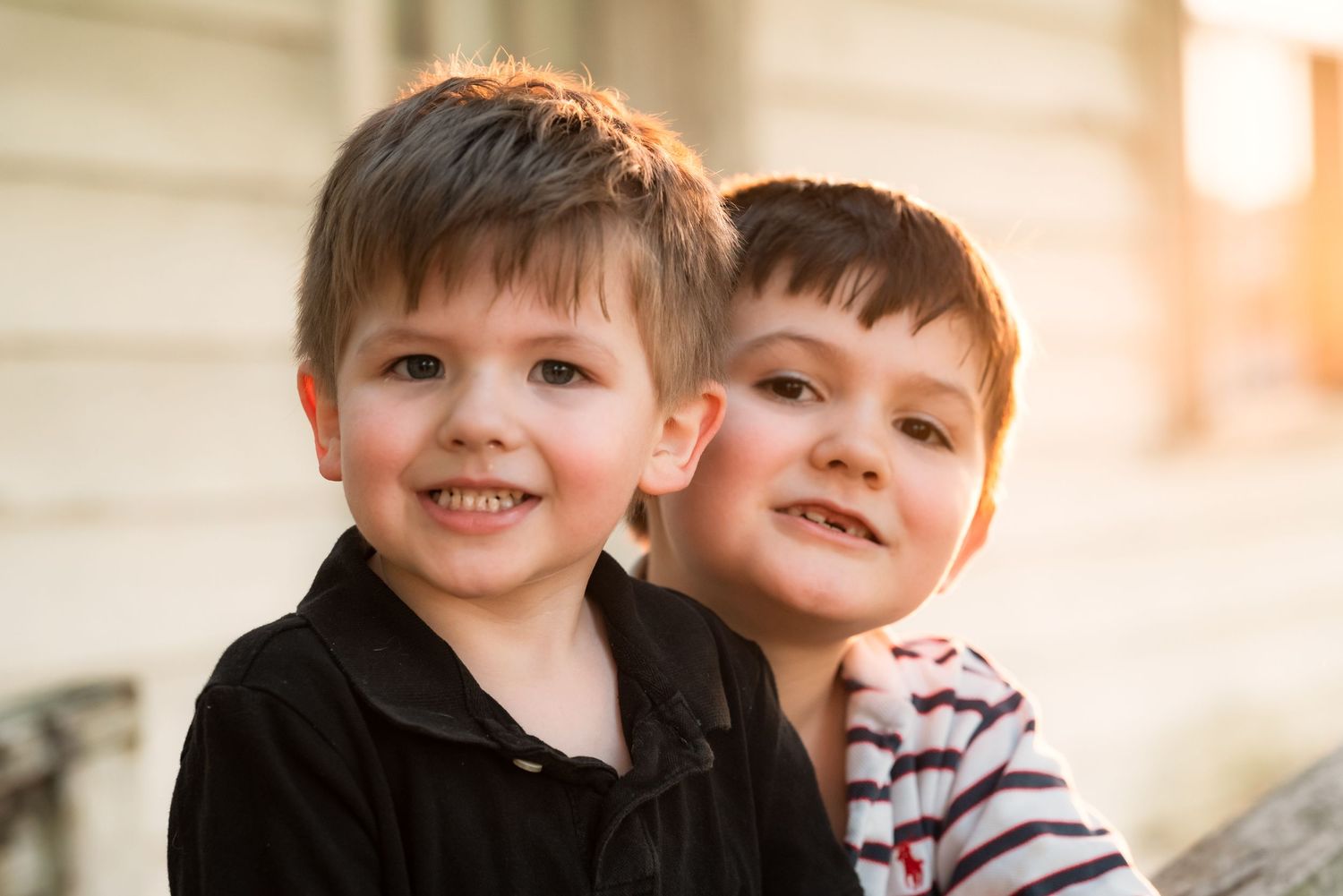 Close up portrait with warm lighting and joyful expressions.