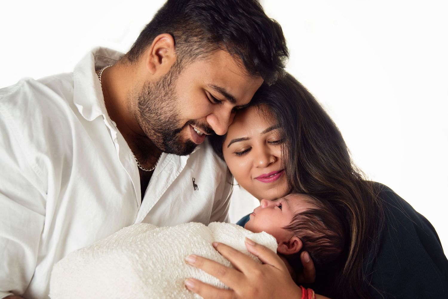mother and father with their newborn baby girl, Kelly Brown safety trained newborn photographer serving the Gold Coast region.