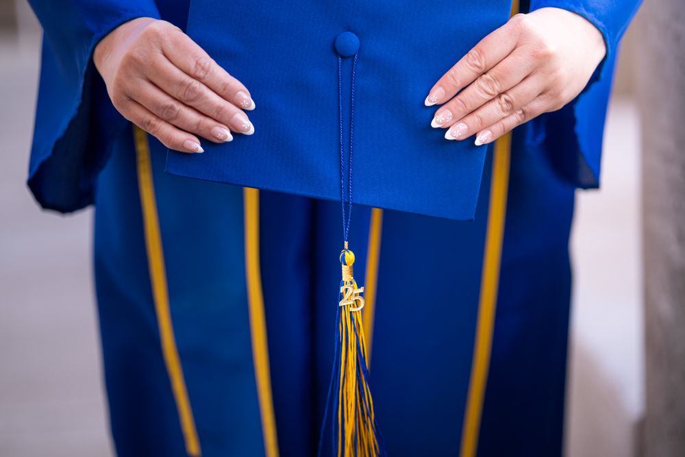 Hands holding cap and tassle 2025 for Central New Mexico Community College in Albuquerque