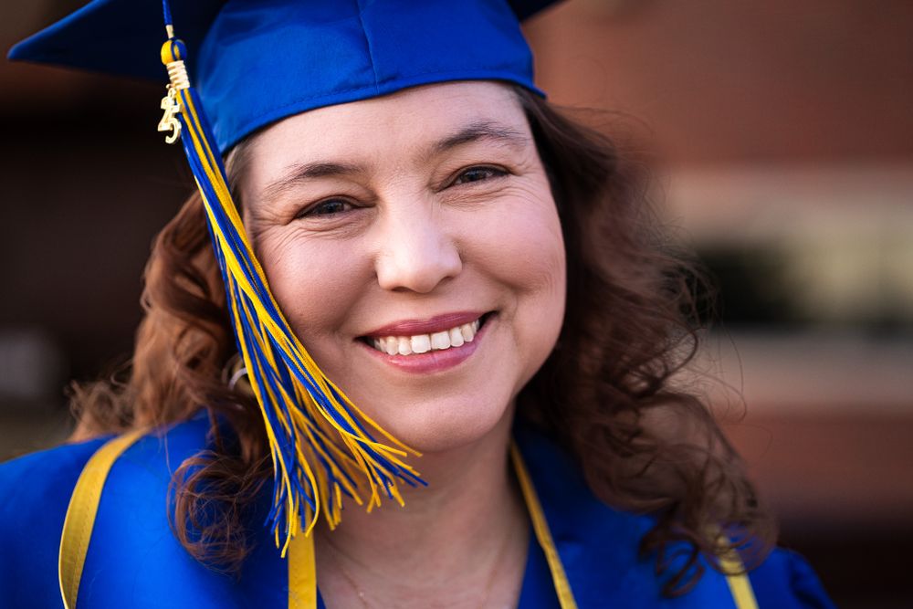 Central New Mexico Community College Graduation Portrait headshot with cap, gown and tassle