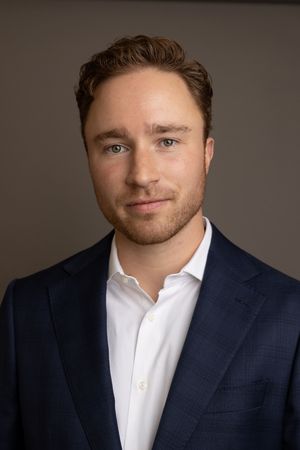 Clean and approachable professional headshot for company website.