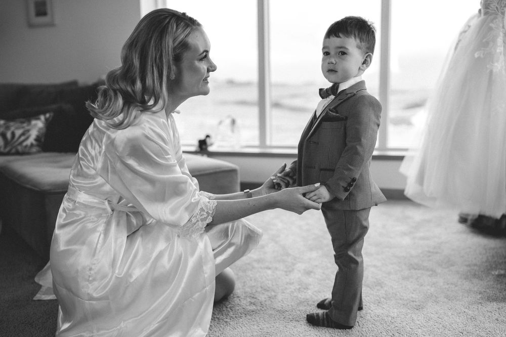 A mother and son share tender moments together in a series of black and white photographs.