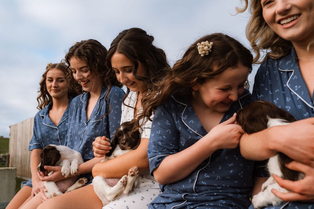 A series of candid outdoor photos showing joyful embraces and laughter between people in casual attire.