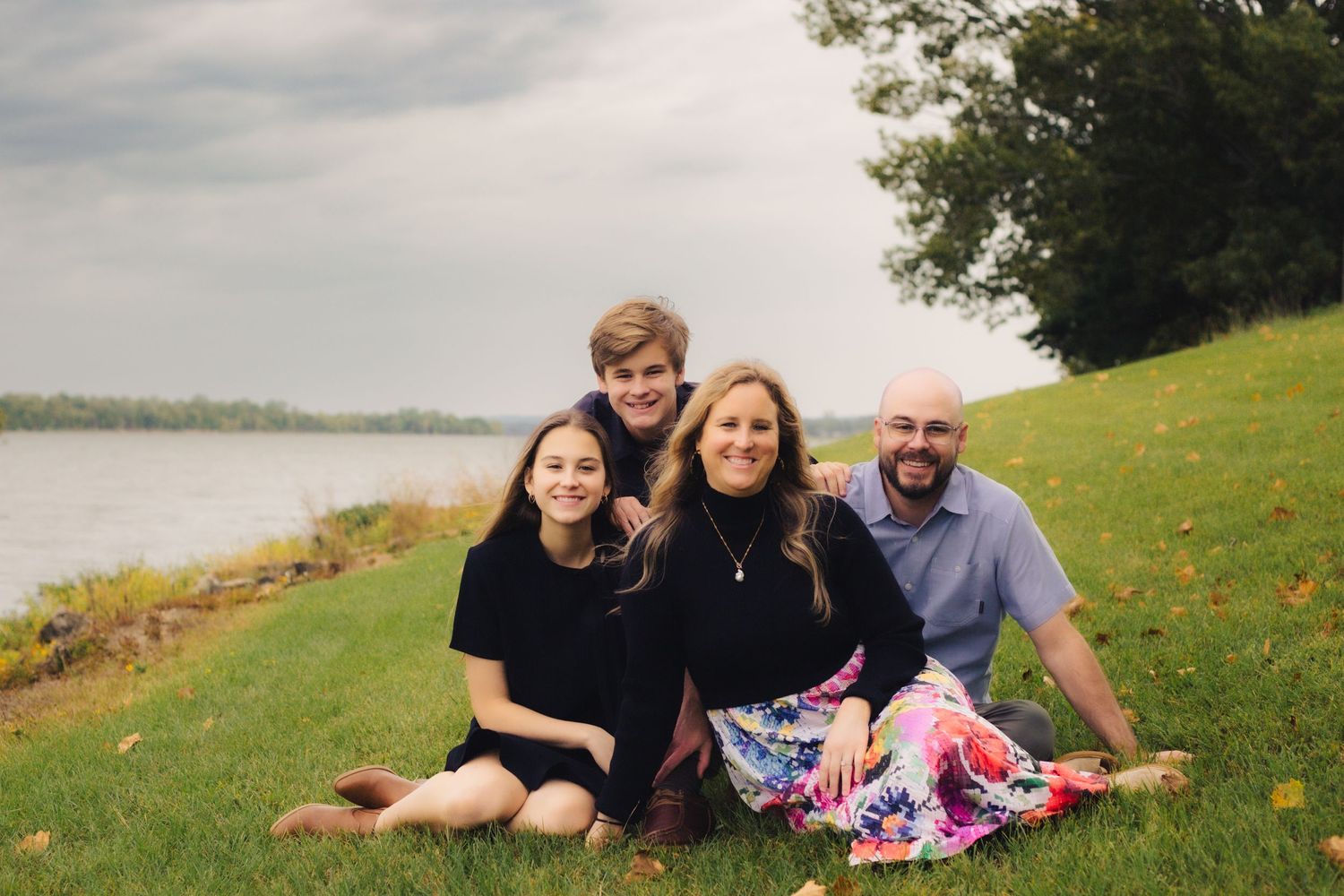 Family with teenagers posed at lake in OKC Metro