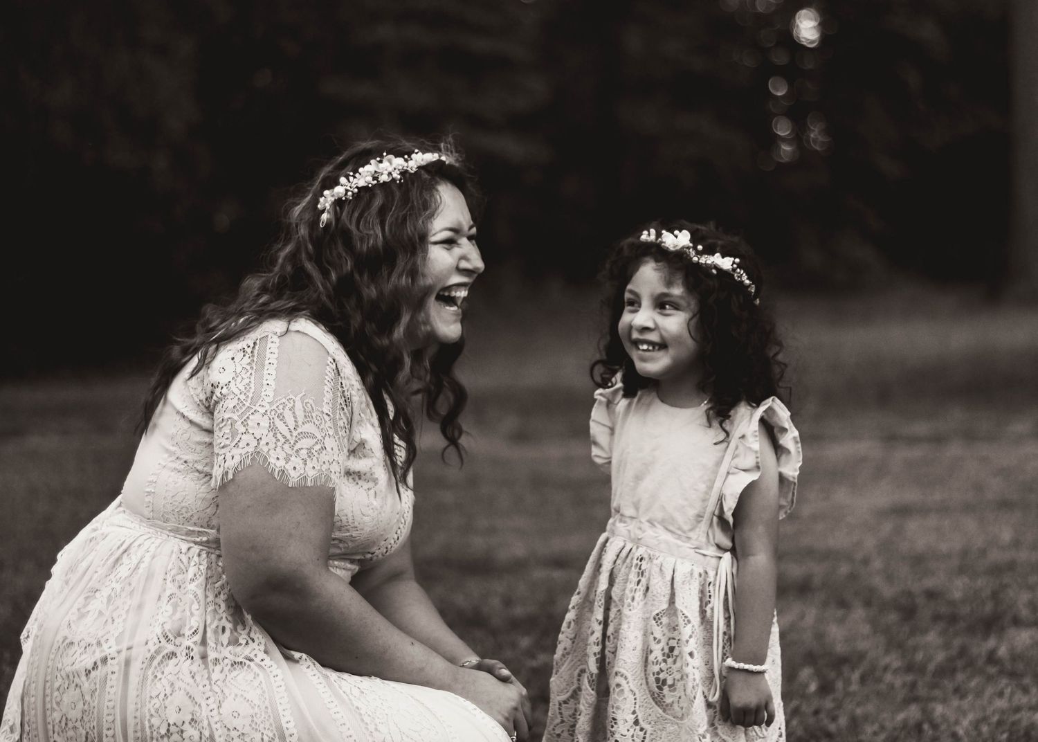 Mother spinning daughter during candid motherhood mini in Moore